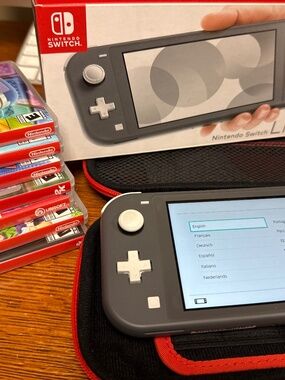 Nintendo switch lite, plus 7 games, travel case, cloth, all in boxes- ALL MINT.